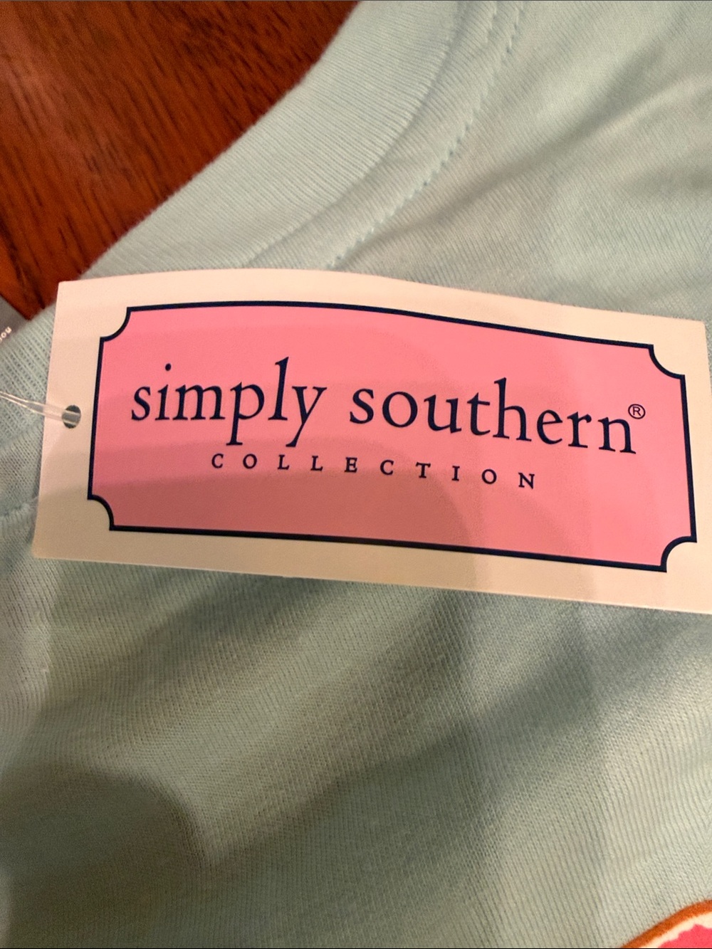 NWT Simply Southern Woman’s Pale Blue Tee with Pink Floral Chest Logo - Picture 4 of 4